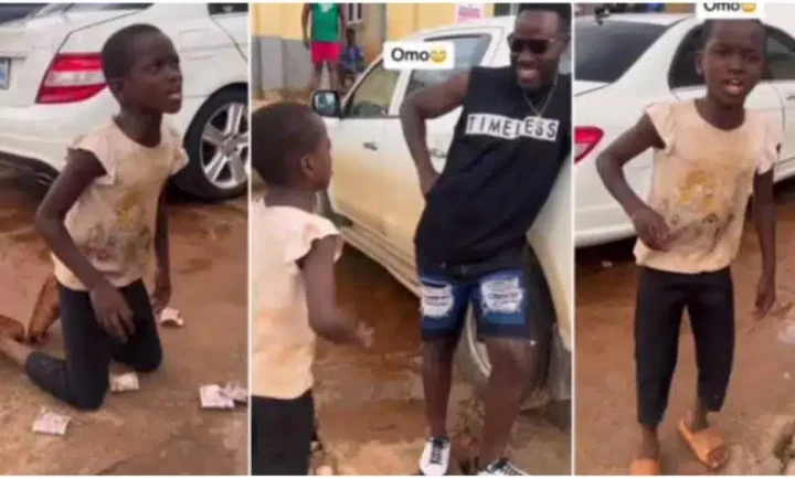 Man showers cash on little boy who hyped him richly with Igbo parables (Video)