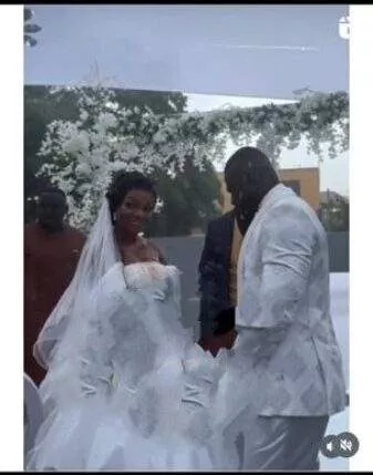 'This is beautiful' - Friends, family stand in heavy rain to celebrate couple on wedding day (Video)