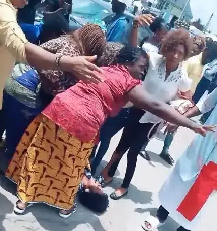 Drama as lady goes into labour while queuing for cash at bank in Port Harcourt (Video)