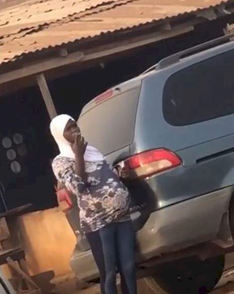 Heavily pregnant woman draws criticism after being spotted smoking by the roadside (video)