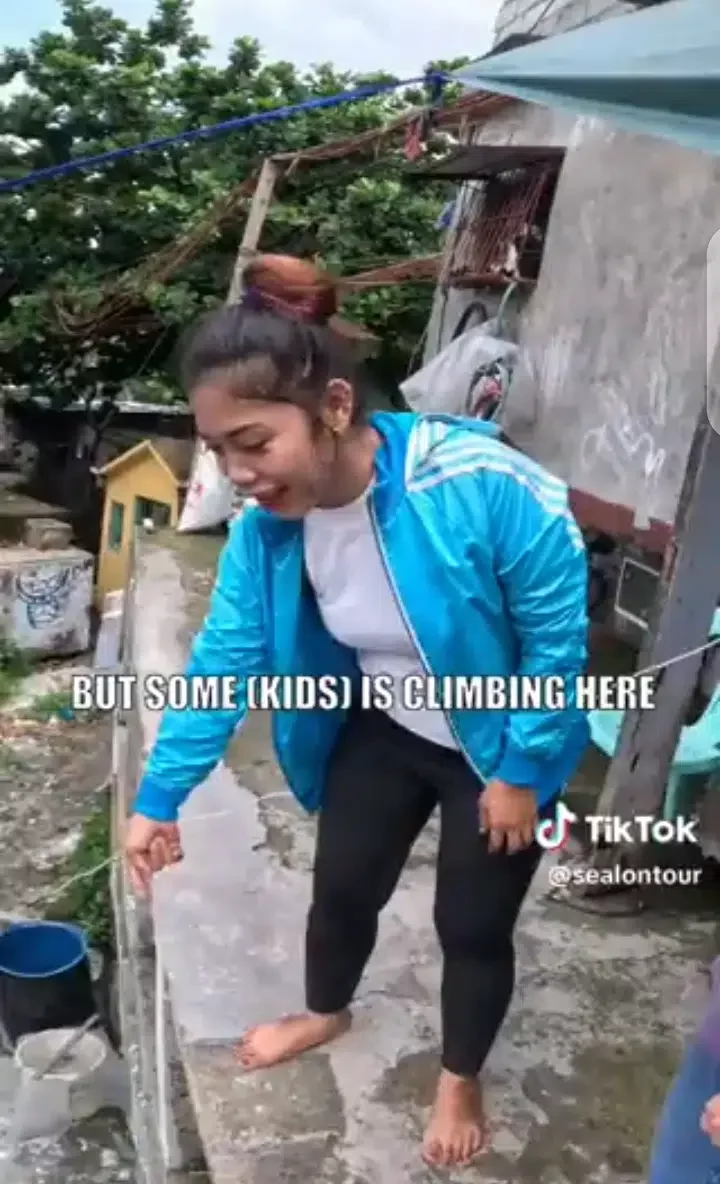 Mixed reaction as family builds house on top of a cemetery in the Philippines (Video)