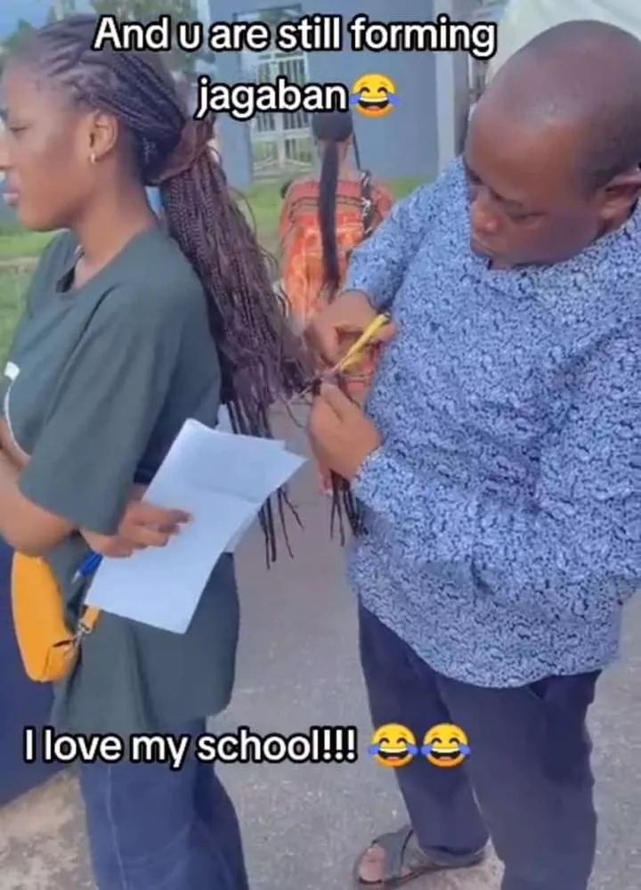 University staff publicly reduces student's hair to approved length (Video)