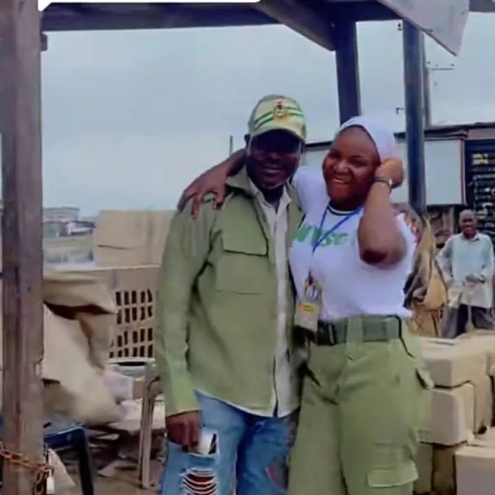 Heartwarming moment as corps member honors father with her NYSC uniform at his block-making factory