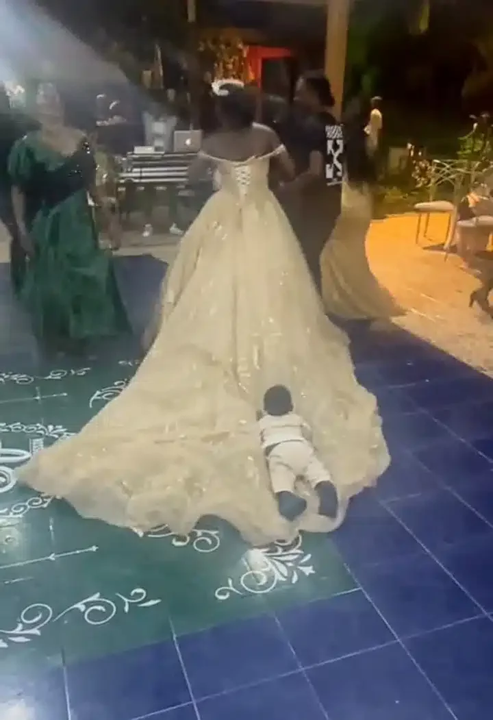 'The marriage is blessed' - Little boy causes stir at wedding as he insists on sleeping on bride's gown