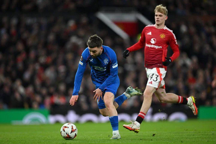 Nicolas Raskin of Rangers FC runs for the ball under pressure from Toby Collyer of Manchester United during the UEFA Europa League 2024/25 League P...