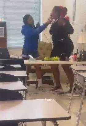 Female teacher beats up student for slapping her (Video)