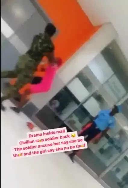 Moment lady lands a slap on a soldier who assaulted her first (Video)