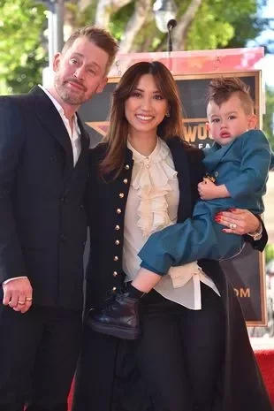 Macaulay Culkin, from left, Brenda Song, and son Dakota Song Culkin attend a ceremony honoring Macaulay Culkin with a star on the Hollywood Walk of Fame on Friday, Dec. 1, 2023, in Los Angeles