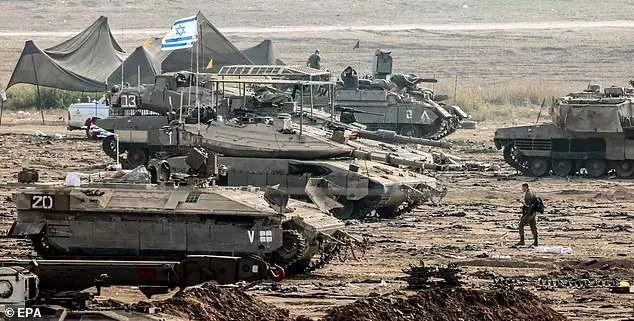 Israeli troops are seen close to the Gaza border on Monday, with an invasion expected at any moment