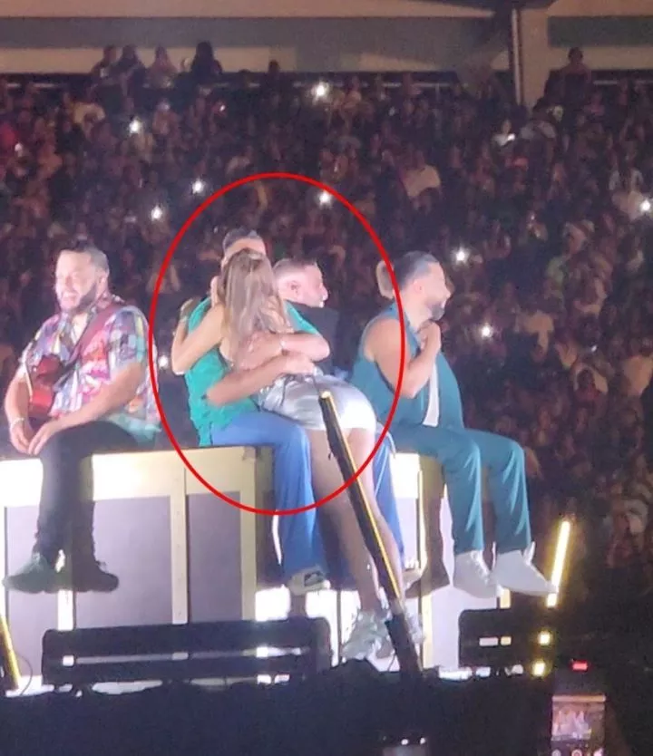 Husband divorces wife after she jumped on stage to kiss singer during live performance (video)