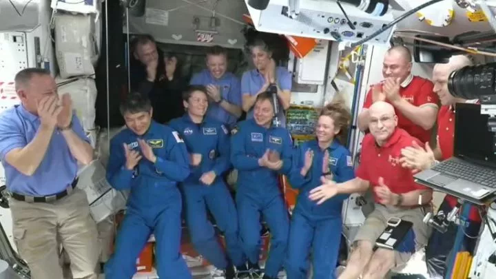 Butch Wilmore (back row centre) and Suni Williams (back row right) celebrate with the rest of the astronauts replacing them on the International Space Station.