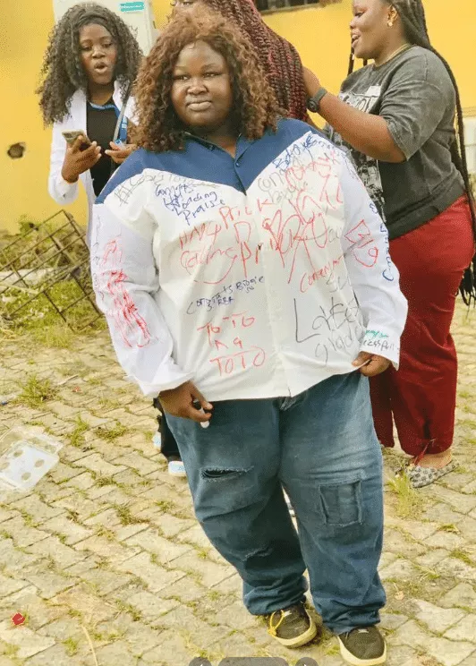 Photos of plus-sized female graduate goes viral as she signs out in grand style