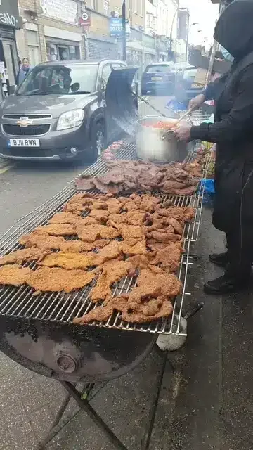 Man celebrates growth, moves roadside 'suya' business to big shop in UK