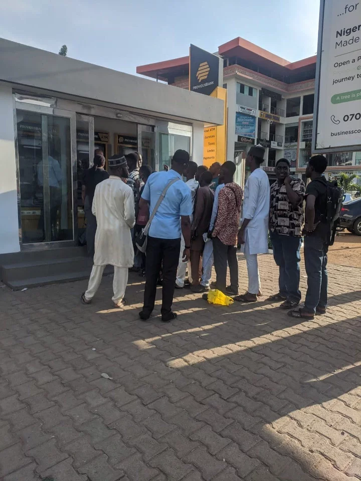 Bank Customers queue for cash at at Providus Bank in Central Business District,Abuja.