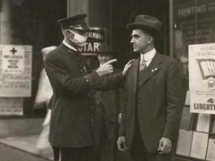 A Policeman In San Francisco Scolds A Man For Not Wearing A Mask During The 1918 Influenza Pandemic, 1918 