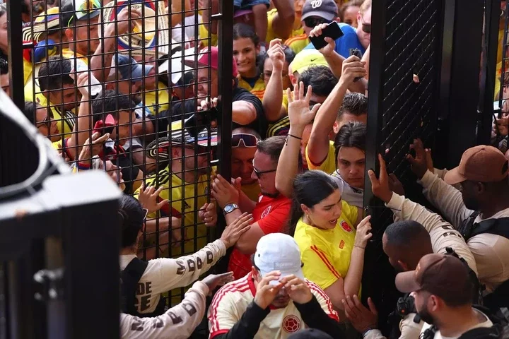 Fans were pushed against the gates in distressing scenes