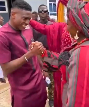 Super Eagles star Taiwo Awoniyi cries as he blesses his twin sister's traditional marriage