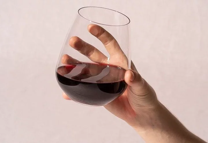 How to Hold a Wine Glass Properly & Why It Matters