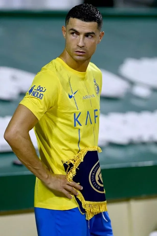 Nassr's Portuguese forward and captain #07 Cristiano Ronaldo stands before the Saudi Pro League football match between Al-Nassr and Al-Fateh at the Prince Abdullah Bin Jalawi Stadium in al-Hasa, on August 25, 2023