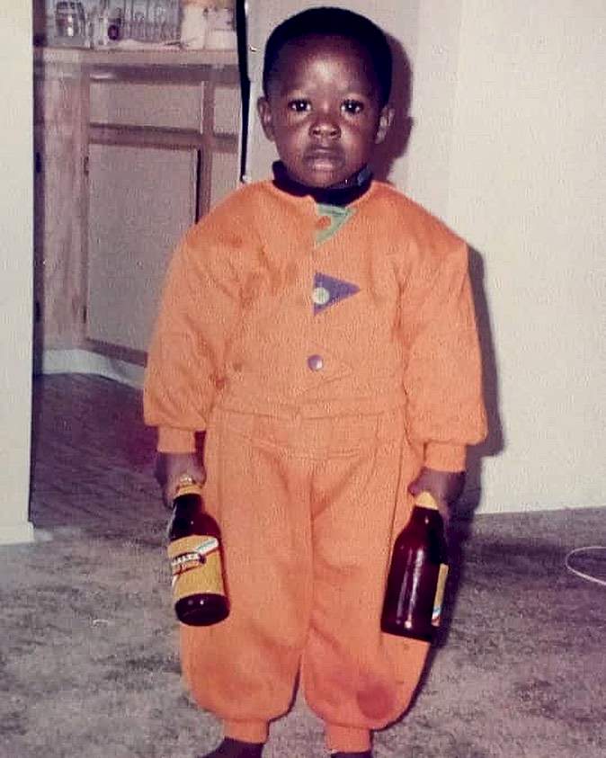 'Lawyer wey dey break bottles for bar' - Fans react as Davido's lawyer reveals he is the kid in this viral photo