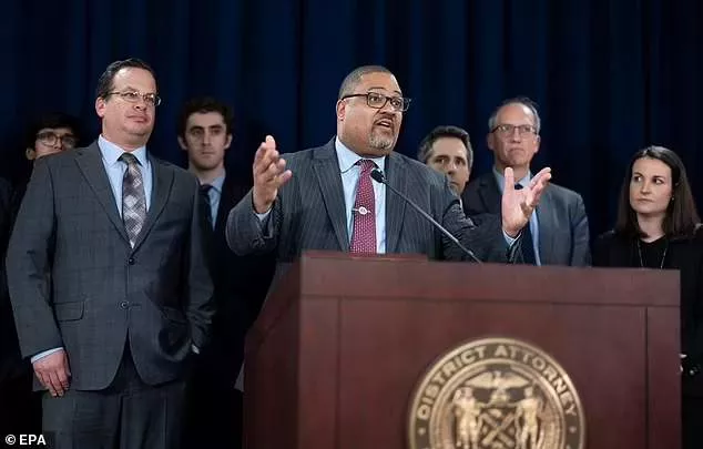 Manhattan District Attorney Alvin Bragg (center) speaks with prosecutor Joshua Steinglass (left) next to him at a triumphant press conference after the verdict