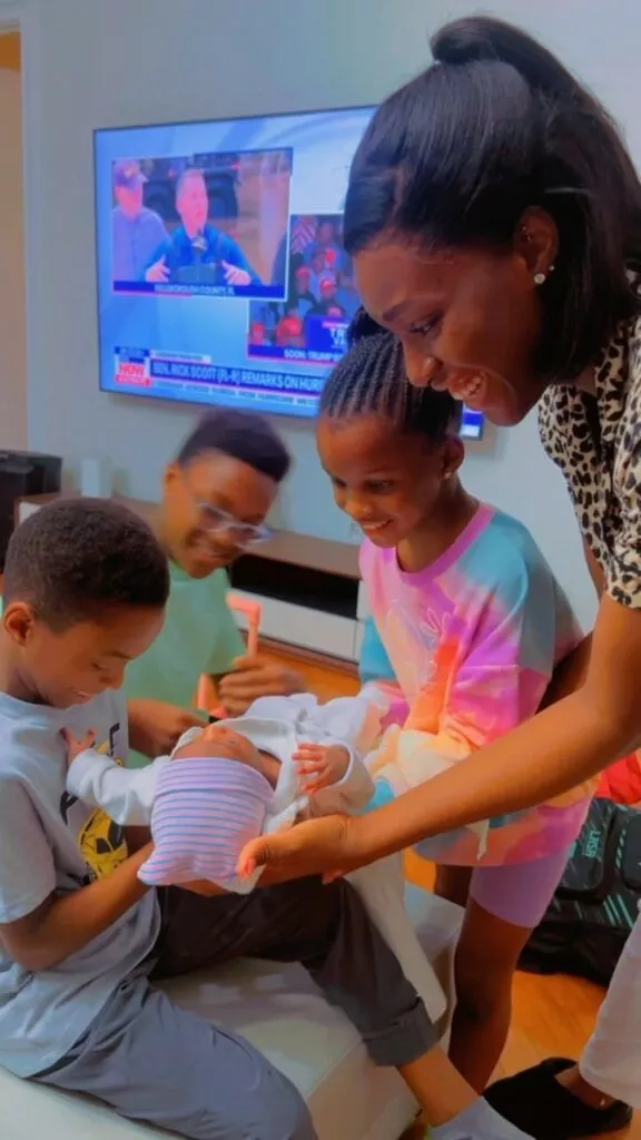 Anita Okoye hailed as Paul introduces their children to Ivy's newborn baby