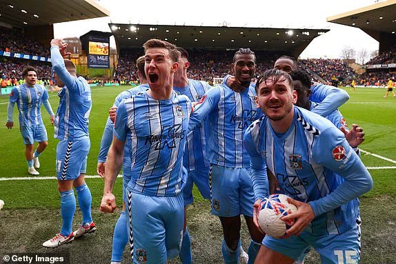 WOLVERHAMPTON, ENGLAND - MARCH 16: Haji Wright of Coventry City celebrates scoring the winning goal with Ben Sheaf and Liam Kitching at Molineux on March 16, 2024 in Wolverhampton, England. (Photo by Marc Atkins/Getty Images)