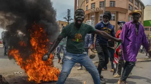 Kenyan president fires ministers after anti-tax protests