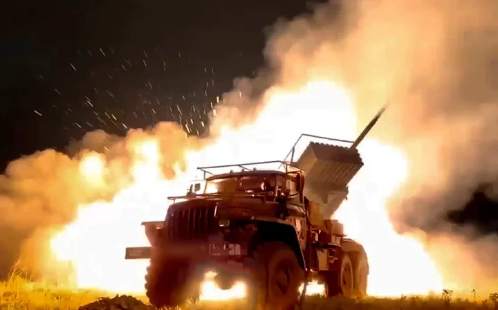 A Russian rocket launcher fires toward Ukrainian position