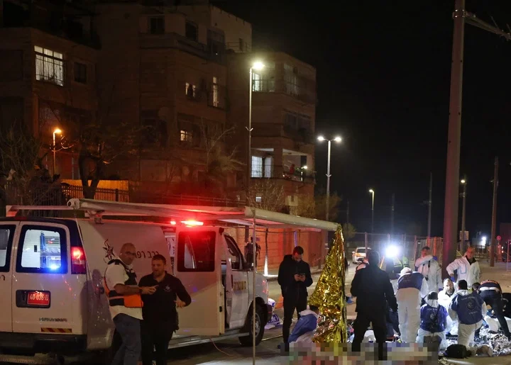 Israeli emergency personnel help victims at the site of a reported attack