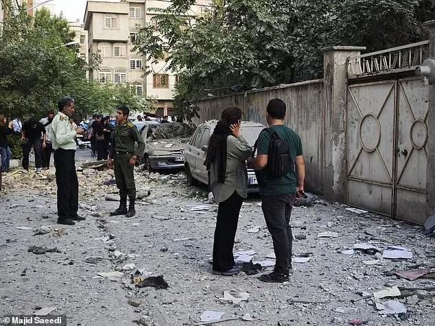 People look over damage following Israeli airstrikes on June 13, 2025 in Tehran