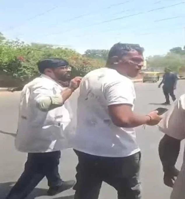 Astonishing footage showed the man walking away from the scene with some visible injuries to his face