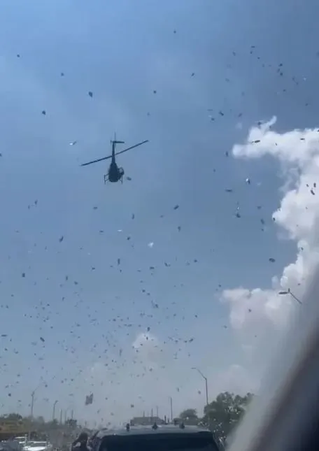 De@d Man's Life Savings Dropped From Helicopter As Mourners Scramble To Grab What They Can (Photos)