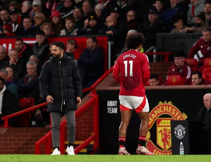 Joshua Zirkzee of Manchester United with Ruben Amorim, Manager of Manchester United after been substituted during the Premier League match between ...