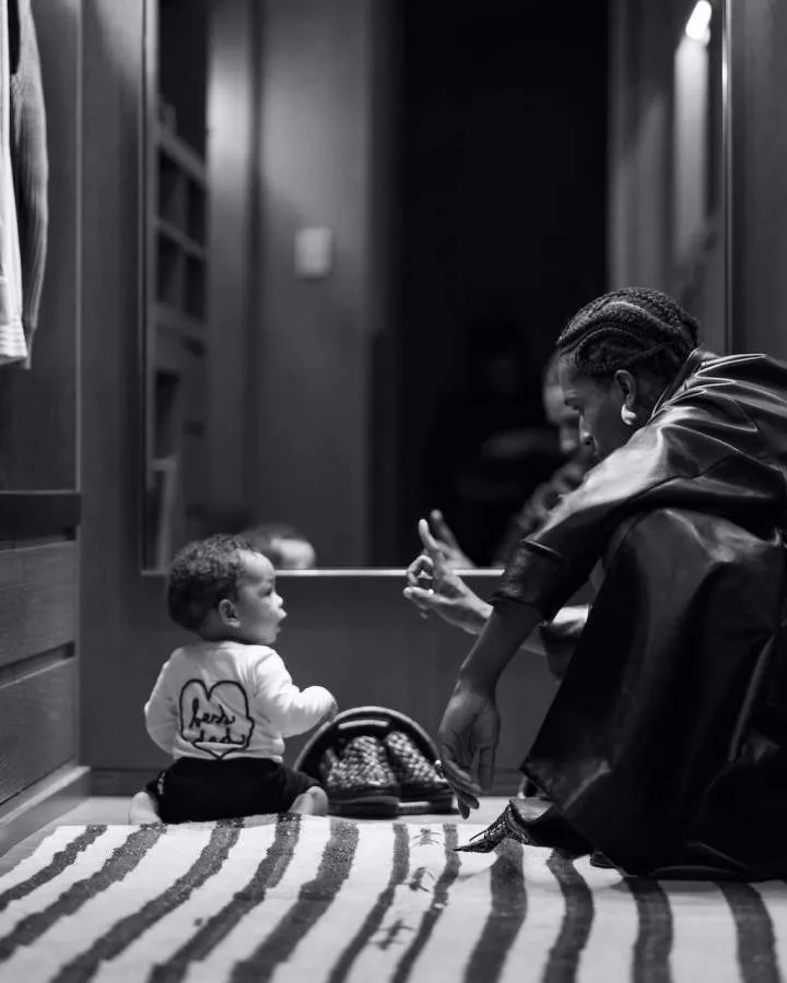 a person and a child sitting on a floor