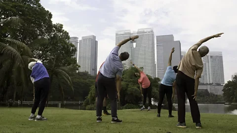 Getty Images Singapore's public parks serve as a hub for community - a factor that is essential to living a long, healthy life (Credit: Getty Images)