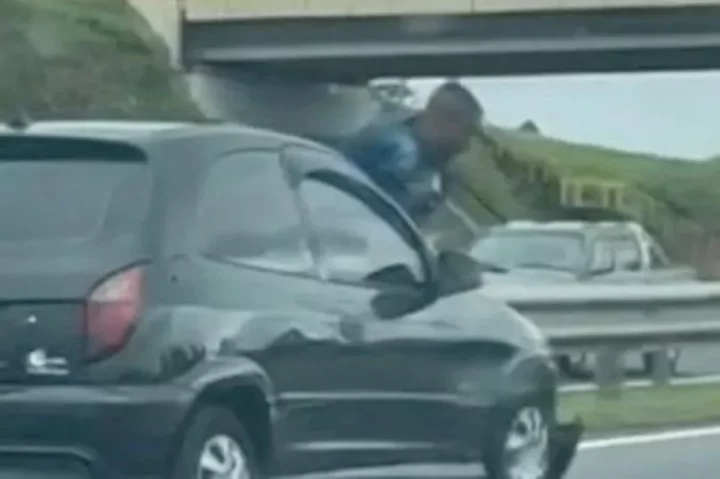 Woman speeds off and flings ex from bonnet after he clung to her car when she dumped him (video)