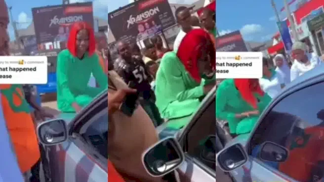 Lady makes a scene to prevent husband from zooming off with their kids after dumping her (Video)