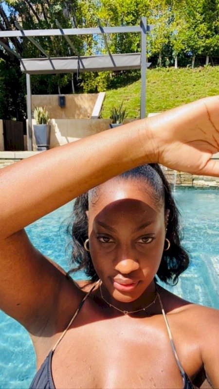 Tems Heats Up Social Media with New Sexy Photos of Herself in a Pool