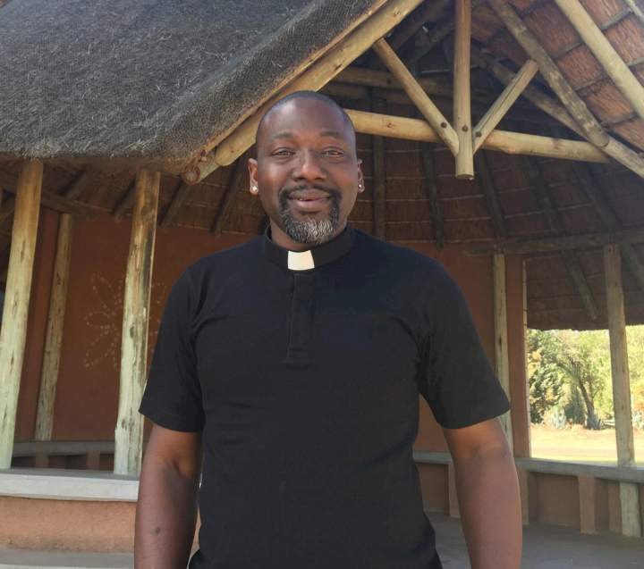 A gay British-Nigerian priest is celebrating his second anniversary in the Anglican Church