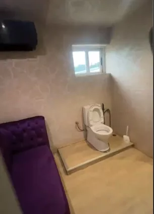Lady puzzled as she sees sofa in toilet at an Abuja restaurant