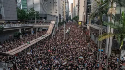 Getty Images Protesters at a pro-democracy and anti-Chinese government control mass demonstration in Hong Kong on 16 June, 2019