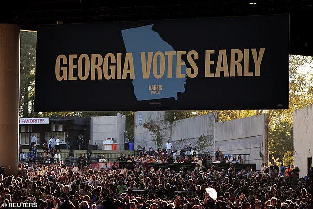 A 'Georgia Votes Early' sign hanging over supporters at Kamala Harris' campaign event in Atlanta. Her rally was the vice president's first visit to the state since early in-person voting kicked off on Tuesday