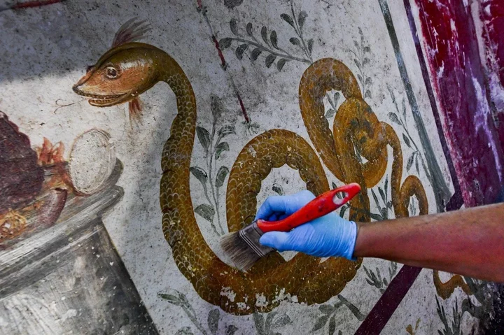 Workers cleaned the frescoes and vivid art found at the House of Phaedra