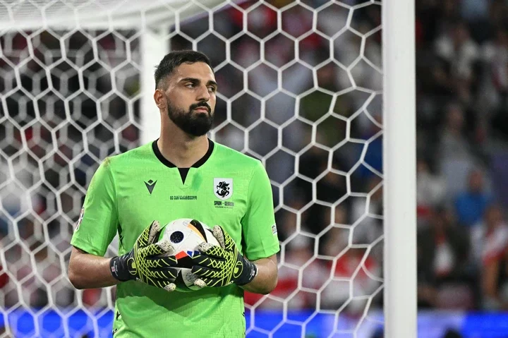 Georgia's goalkeeper #25 Giorgi Mamardashvili holds the ball during the UEFA Euro 2024 round of 16 football match between Spain and Georgia at the ...