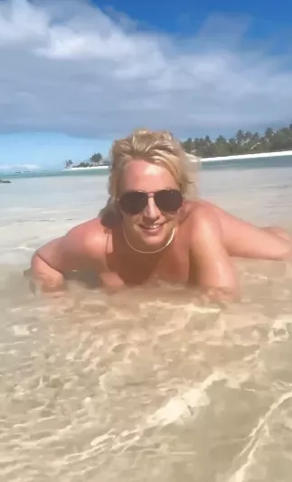 Britney Spears shares nude video on the beach as she admits she wants butt injections