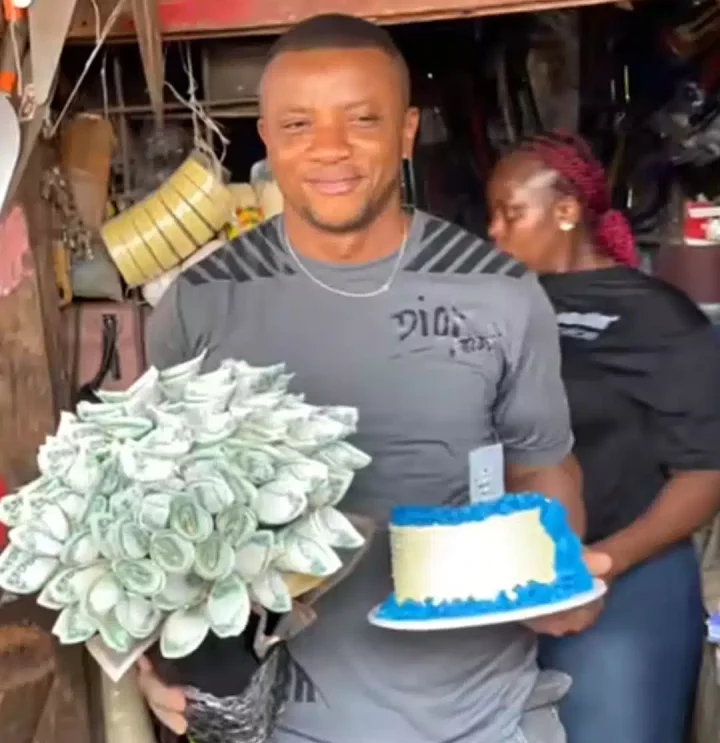 'My world best' - Emotions flow as wife storms husband's shop, gifts him money bouquet, phone, cake on his birthday