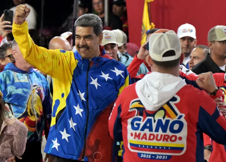 Venezuelan President and presidential candidate Nicolas Maduro celebrates following his 'win'