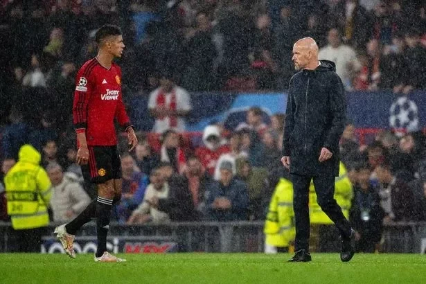 MANCHESTER, ENGLAND - OCTOBER 03: Manager Erik ten Hag and Raphael Varane of Manchester United walk off after the UEFA Champions League match between Manchester United and Galatasaray A.S. at Old Trafford on October 03, 2023 in Manchester, England. (Photo by Ash Donelon/Manchester United via Getty Images )