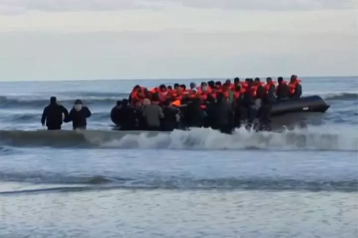 Footage from BBC News shows migrants in small boat at Dunkirk on Tuesday morning after the French coat guard confirmed at least five people had died attempting to cross the English Channel